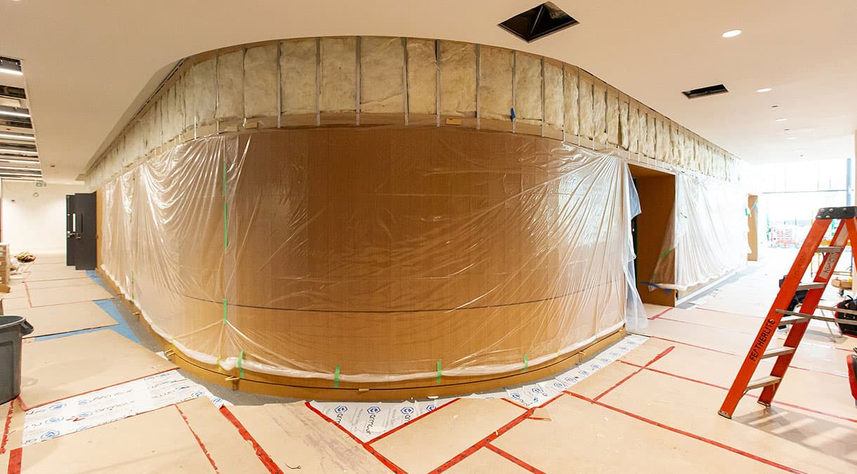 Large rounded wall with wooden panelling