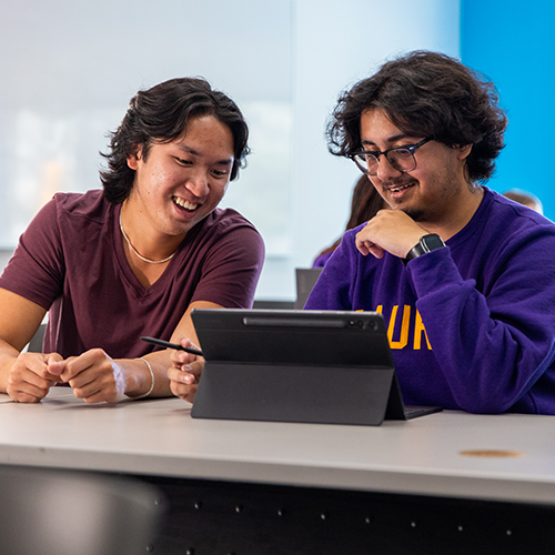 Two students sitting in a classroom