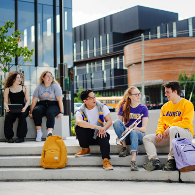 music students sitting in the outdoor ampatheater