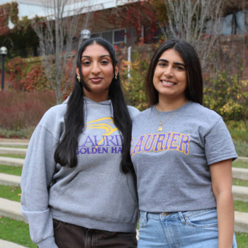 Call centre students Trilochan And Rimsha posing in Laurier Gear on campus