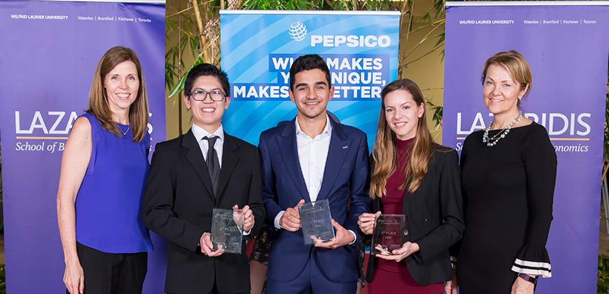 students holding award