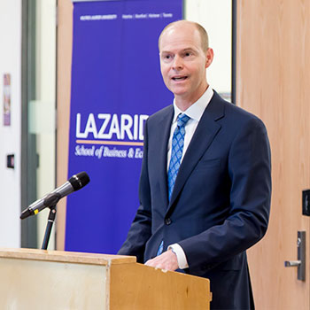 man speaking at a podium