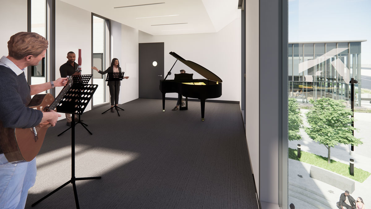 Inside a practice studio. White walls, gray carpet, a grand piano. Large windows on the left and right and a door in the back. Right windows overlook entranceway. Four students playing instruments.