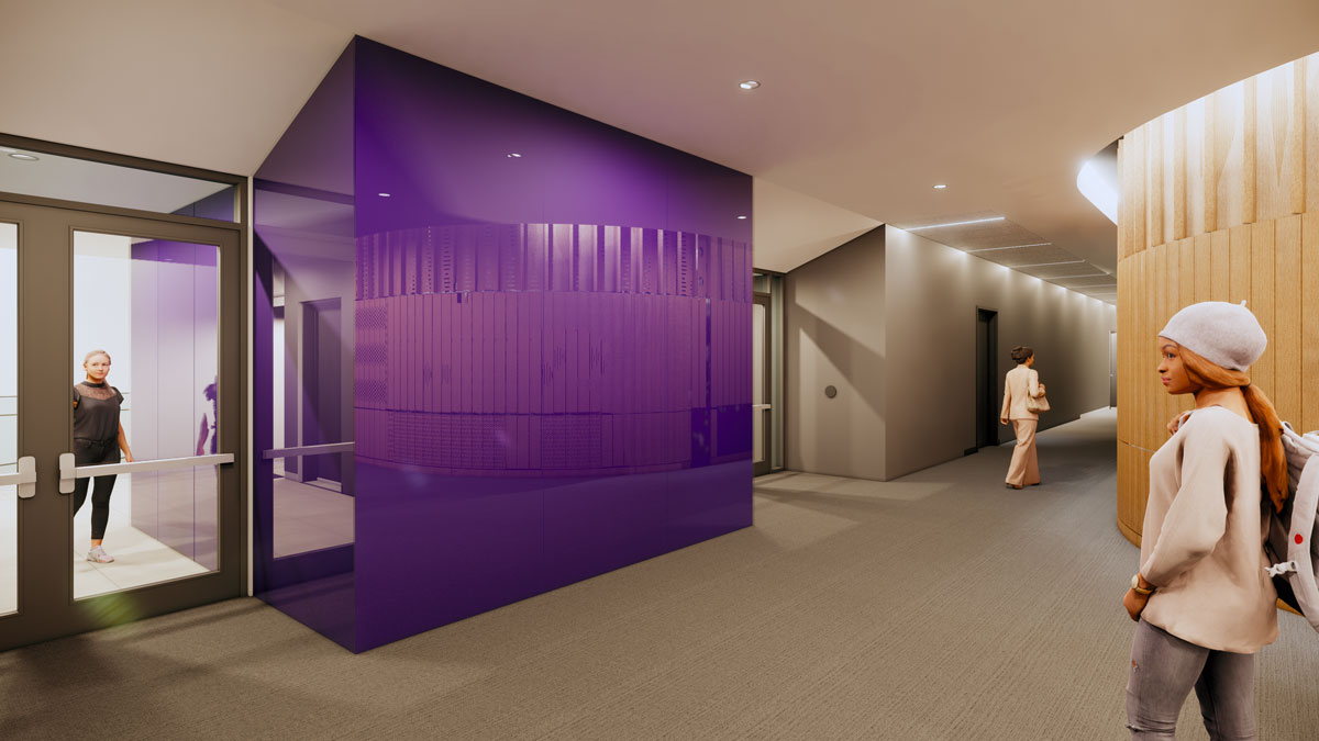 Inside, a view of the entrance doors to the left, with a woman entering, a purple wall in the middle, a hallway with a person walking in the top right and a student to the right by a light wood wall.
