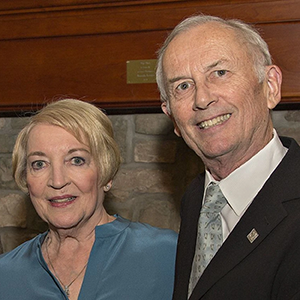 Margot and Paul Williamson grin at the camera. 