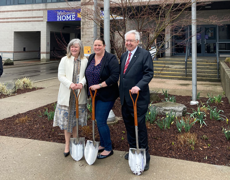 Christine Chamberlain, Maria Harper and Savvas Chamberlain with groundbreaking shovels outside the Faculty of Music building