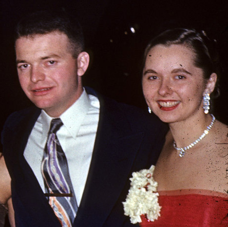 A young couple in fancy dress, circa 1960s.