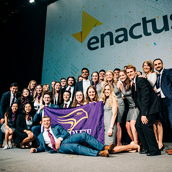 Laurier's Enactus team celebrates on stage after they win first place in Canada